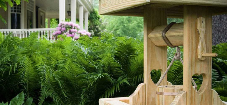 Фото-идеи оформления домика для колодца: красивое и практичное решение